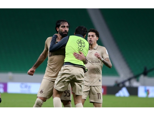 Al Rayyan's Mohammed Saleh (left) celebrates with teammates after scoring the late equaliser.