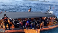 This handout picture taken and released on January 4, 2026 by Indonesia's National Search and Resque Agency (BASARNAS) shows rescue personnel securing a body bag containing the remains of missing Spanish man Fernando Martin Carreras, from waters off Labuan Bajo in East Nusa Tenggara. Photo by HANDOUT / INDONESIA'S NATIONAL SEARCH AND RESCUE AGENCY (BASARNAS) / AFP