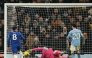 Manchester City's Italian goalkeeper #25 Gianluigi Donnarumma makes a save as Chelsea's Argentinian midfielder #08 Enzo Fernandez prepares to score during the English Premier League football match between Manchester City and Chelsea at the Etihad Stadium in Manchester, north west England, on January 4, 2026. (Photo by Oli SCARFF / AFP)