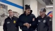 This screengrab taken from the X account of Rapid Response 47, the official White House rapid response account, shows Venezuelan President Nicolas Maduro (C) escorted by DEA agents inside the headquarters of the US Drug Enforcement Administration (DEA) in lower Manhattan, New York, on January 3, 2026. (Photo by X account of Rapid Response 47 / AFP)