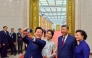 South Korea's President Lee Jae Myung (L) and his wife Kim Hea Kyung (2nd L) take a selfie with China's President Xi Jinping (2nd R) and his wife Peng Liyuan (R) after a dinner at the Great Hall of the People in Beijing on January 5, 2026. (Photo by YONHAP / AFP