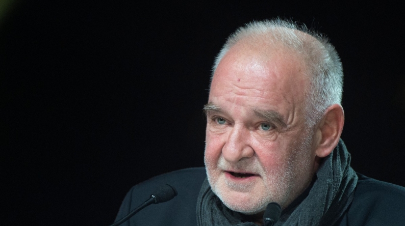 (FILES) Hungarian film director Bela Tarr speaks during the opening ceremony of the 16th edition of the Marrakech International Film Festival on December 2, 2016, in Marrakesh, Morocco. (Photo by FADEL SENNA / AFP)