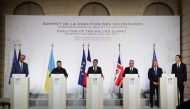 (From L) Germany's Chancellor Friedrich Merz, Ukraine's President Volodymyr Zelensky, France's President Emmanuel Macron, Britain's Prime Minister Keir Starmer, US Special Envoy Steve Witkoff and US businessman Jared Kushner deliver a press conference upon the signing of the declaration on deploying post-ceasefire force in Ukraine on January 6, 2026. (Photo by Ludovic Marin / Pool / AFP)