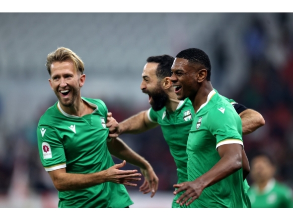 Al Ahli's Sekou Yansane (right) celebrates with teammates.