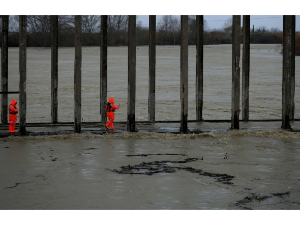 Members of the Civil Emergencies services monitor the Vjosa River in the village of Novosele, near Vlore on January 8, 2026. Photo by Adnan Beci / AFP