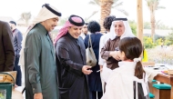 Minister of Environment and Climate Change H E Dr. Abdulla bin Abdulaziz bin Turki Al Subaie and officials interacting with students during the event at Al Khater House on Wednesday. 