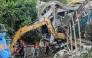 Search and rescue teams look for people after a landslide at the landfill in Barangay Binaliw, Cebu City on January 9, 2026. (Photo by Cheryl Baldicantos / AFP)