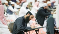 Participants during their written test for muezzins.