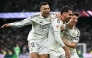Real Madrid's Spanish defender #17 Raul Asencio (C) celebrates with Real Madrid's French forward #10 Kylian Mbappe (L) and Real Madrid's Turkish midfielder #15 Arda Guler after scoring his team's second goal during the Spanish league football match between Real Madrid CF and Levante UD at Santiago Bernabeu Stadium in Madrid on January 17, 2026. (Photo by Javier SORIANO / AFP)
