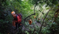 Joint search and rescue teams climb towards the suspected crash site of an Indonesia Air Transport turboprop plane that lost contact a day earlier while flying from Yogyakarta to Makassar, in the Bulusaraung Mountains, South Sulawesi, Indonesia, January 18, 2026. Photo by Muchtamir / AFP