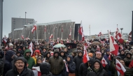 Photo for representation only. People take part in a demonstration that gathered almost a third of the city population to protest against the US President's plans to take Greenland, on January 17, 2026 in Nuuk, Greenland. (Photo by Alessandro RAMPAZZO / AFP)
