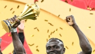 Senegal's forward #10 Sadio Mane holds the trophy after the Africa Cup of Nations (CAN) final football match between Senegal and Morocco at the Prince Moulay Abdellah Stadium in Rabat on January 18, 2026. (Photo by Sebastien Bozon / AFP)