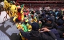 Fans scuffle with security personnel as they storm the field after a penalty decision against Senegal during the Africa Cup of Nations (CAN) final football match between Senegal and Morocco at the Prince Moulay Abdellah Stadium in Rabat on January 18, 2026. (Photo by Franck FIFE / AFP)