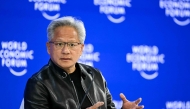 Nvidia founder and CEO Jensen Huang gestures as he speaks during the World Economic Forum (WEF) annual meeting in Davos on January 21, 2026. Photo by Fabrice COFFRINI / AFP