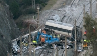 Emergency services and investigators work on the site of a high-speed trains collision that killed at least 42 people, in Adamuz, southern Spain, on January 20, 2026. Photo by JORGE GUERRERO / AFP
