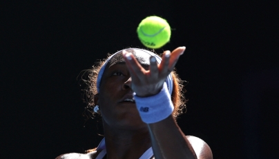 USA's Coco Gauff serves to Czech Republic's Karolina Muchova during their women's singles match on day eight of the Australian Open tennis tournament in Melbourne on January 25, 2026. (Photo by Martin Keep / AFP)