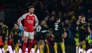 Arsenal's English defender #04 Ben White (L) reacts after Manchester United's Brazilian striker #10 Matheus Cunha scored his team's third goal in the 87th minute during the English Premier League football match between Arsenal and Manchester United at the Emirates Stadium in London on January 25, 2026. (Photo by Ben STANSALL / AFP)