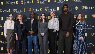 (L-R) BAFTA CEO Jane Millichip, Chair of BAFTA, Sara Putt, British actor David Jonsson, British actor Aimee Lou Wood, Chair of the Film Committee, Emily Stillman, Deputy Chair of the Film Committee, Anthony Andrews and Executive Director of Awards and Content, Emma Baehr pose for a picture at the announcement of the British Academy Film Awards (BAFTA) nominations in central London on January 27, 2026. (Photo by JUSTIN TALLIS / AFP)