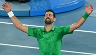 Serbia's Novak Djokovic celebrates victory over Italy's Jannik Sinner after their men's singles semi-final match on day thirteen of the Australian Open tennis tournament in Melbourne on January 31, 2026. (Photo by William West / AFP)
