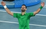 Serbia's Novak Djokovic celebrates victory over Italy's Jannik Sinner after their men's singles semi-final match on day thirteen of the Australian Open tennis tournament in Melbourne on January 31, 2026. (Photo by William West / AFP)