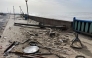 Debris and sand are pictured on a pavement along the coast in Praia da Vieira, after storm Kristin hit Portugal, on January 29, 2026. Photo by Jerome Pin / AFP