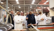 Minister of Commerce and Industry H E Sheikh Faisal bin Thani bin Faisal Al Thani touring one of the factories, yesterday.