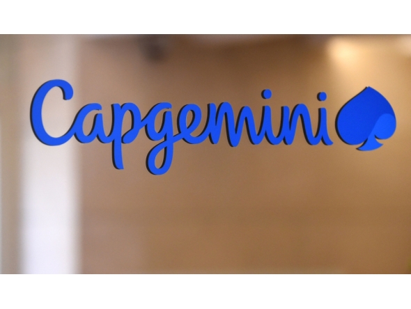This photograph shows a logo of French IT company Capgemini at the Capgemini headquarters in Paris on June 25, 2019. (Photo by Eric Piermont / AFP)