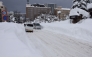 People commute along a snow-covered street in Aomori City, which is experiencing record-breaking heavy snowfall, on February 3, 2026. Photo by JIJI Press / AFP