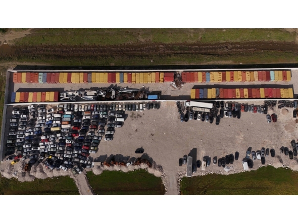 This aerial drone photograph shows containers of toxic industrial waste stored at a controlled site near the port city of Durres on November 8, 2025. (Photo by Adnan Beci / AFP)