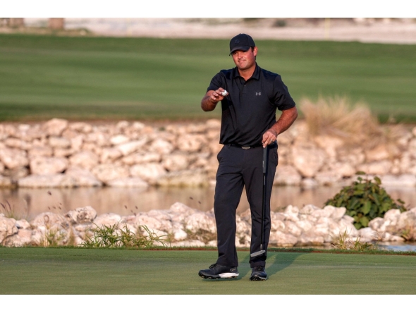 Patrick Reed celebrates after winning the Qatar Masters 2026. (AFP)