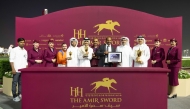 QREC Deputy CEO Ahmed Amanalla Al-Sheebani awarded trophies to the connections of Dubawi Spectre. PICS: Juhaim/QREC 
