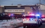 Police stand outside the perimeter they created around the Dennis M. Lynch Arena where a shooting occurred earlier today in Pawtucket, Rhode Island, on February 16, 2026. Photo by Joseph Prezioso / AFP