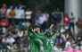Pakistan's Shadab Khan (L) celebrates with wicketkeeper Usman Khan after taking the wicket of Namibia's Alexander Busing-Volschenk in Colombo on February 18, 2026. (Photo by Ishara S. Kodikara / AFP)