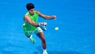 Spain’s Carlos Alcaraz hits a return against France’s Valentin Royer. PICS: AFP