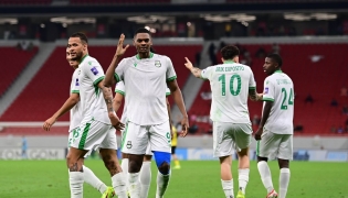 Al Ahli’s Sekou Yansane (foreground) celebrates his goal with teammates. 