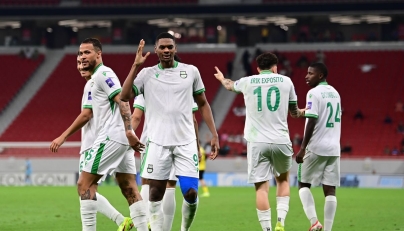 Al Ahli’s Sekou Yansane (foreground) celebrates his goal with teammates. 