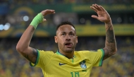 (FILES) Brazil's forward Neymar gestures during the 2026 FIFA World Cup South American qualification football match between Brazil and Venezuela at the Arena Pantanal stadium in Cuiaba, Mato Grosso State, Brazil, on October 12, 2023. (Photo by NELSON ALMEIDA / AFP)