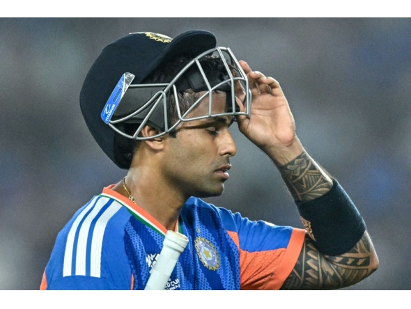 India's captain Suryakumar Yadav walks back to the pavilion after his dismissal in Ahmedabad on February 22, 2026. (Photo by Manan Vatsyayana / AFP)