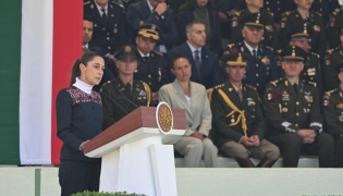 Mexico's President Claudia Sheinbaum delivers a speech during the celebration of Flag Day in Mexico City on February 24, 2026. (Photo by YURI CORTEZ / AFP)
