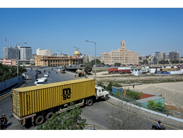 A truck troller is parked to block the road leading to the US Consulate in Karachi on March 2, 2026. Photo by Asif Hassan / AFP
