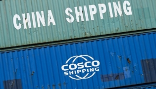 (Files) Containers of China Shipping and Cosco shipping companies are stacked at a transshipment station in Frankfurt am Main, western Germany, on April 15, 2025.  (Photo by Kirill Kudryavtsev / AFP)