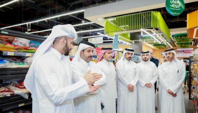 Minister of Commerce and Industry H E Sheikh Faisal bin Thani bin Faisal Al-Thani along with other officials during a visit at a retail outlet.