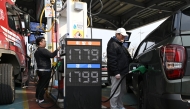 People fill up their cars at a petrol station in Seoul on March 9, 2026. Photo by JUNG YEON-JE / AFP