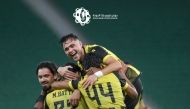 Qatar SC's Mus’ab Al Battat celebrates with teammates. 