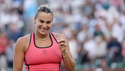Aryna Sabalenka celebrates match point against Linda Noskova of Czech Republic during their Women's Singles Semifinals match. (Photo by Clive Brunskill/AFP)