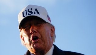 US President Donald Trump speaks to the media before boarding Air Force One on March 13, 2026 at Joint Base Andrews, Maryland. Nathan Howard/Getty Images/AFP 