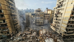  A photograph shows the site of an overnight Israeli airstrike that targeted the Haret Hreik neighbourhood of Beirut's southern suburbs on March 14, 2026.