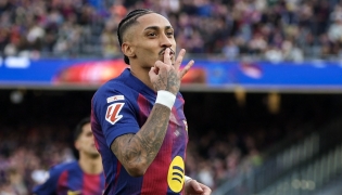 Barcelona's Brazilian forward #11 Raphinha celebrates scoring his team's fourth goal and his hat-tick, during the Spanish League football match between FC Barcelona and Sevilla FC at the Camp Nou Stadium in Barcelona, on March 15, 2026. (Photo by Lluis GENE / AFP)
