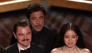 Puerto Rican actor Benicio Del Toro, US actress Chase Infiniti and US actor Leonardo DiCaprio onstage during the 98th Annual Academy Awards. (Photo by Patrick T. Fallon / AFP)