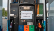 A notice is seen at a temporarily closed petrol station as it waits to be restocked in Bangkok on March 16, 2026 following import disruptions caused by the Middle East conflict. Photo by Anthony WALLACE / AFP 